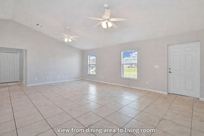 Building Photo - Spacious Three-Bedroom Home with Open Floor Plan, Large Yard & Screened Patio