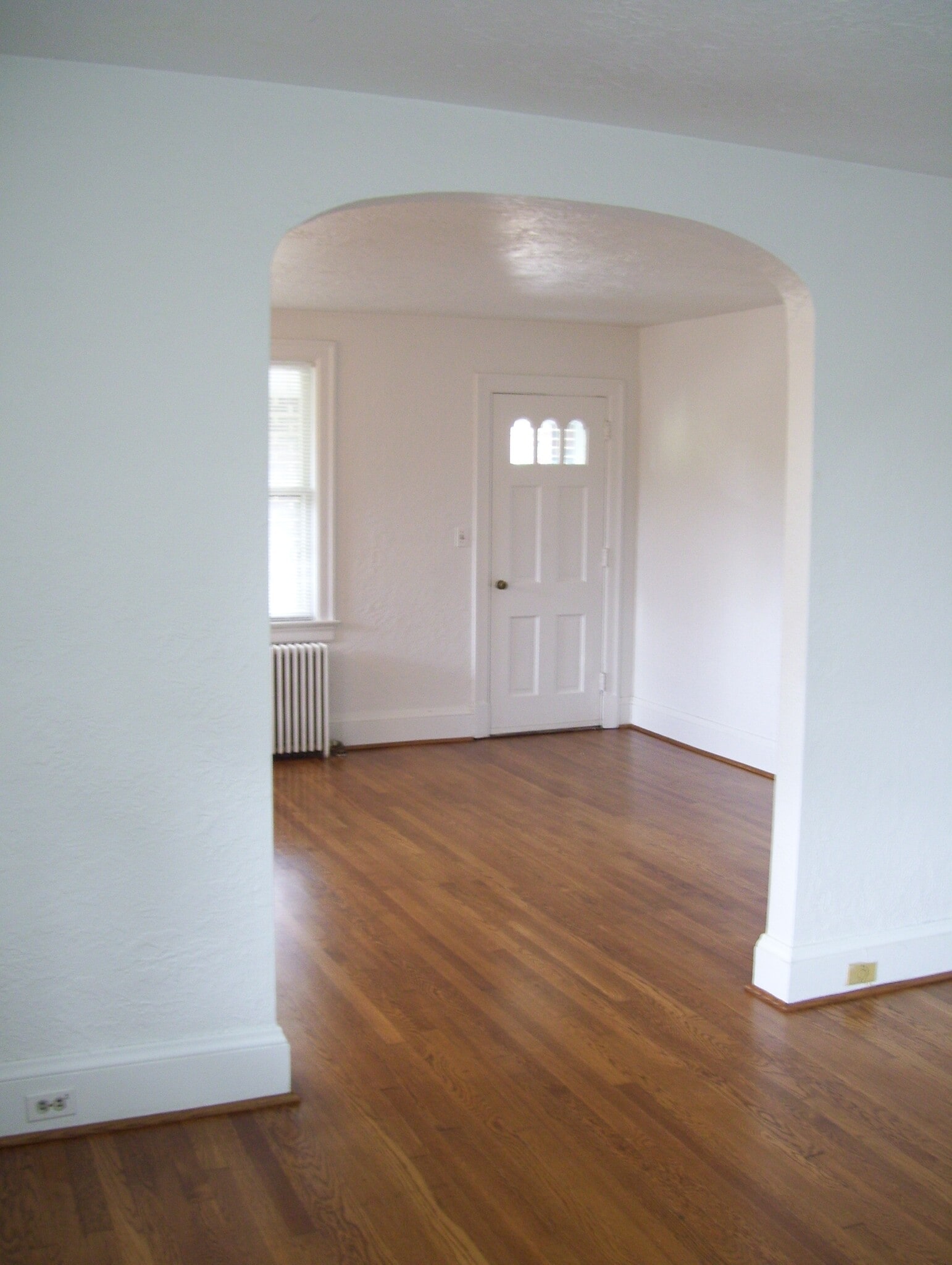 Living room through archway. - 3723 Henrico St