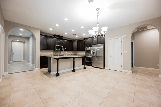 Building Photo - Single Story w/ duel primary suites gated ...
