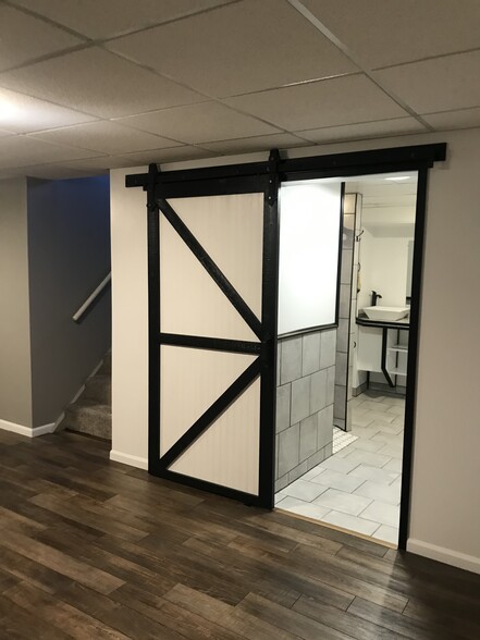 Barn door to basement bathroom - 2414 W 5th St