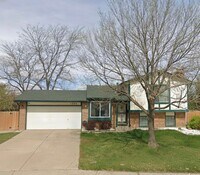 Building Photo - 4BR Tri-Level with Sunroom & Oversized Fenced Yard & 2-Car Garage!