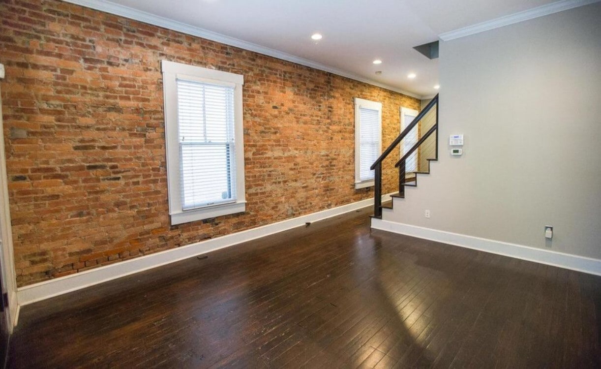 Exposed brick and original hardwood floors. - 715 S 5th St