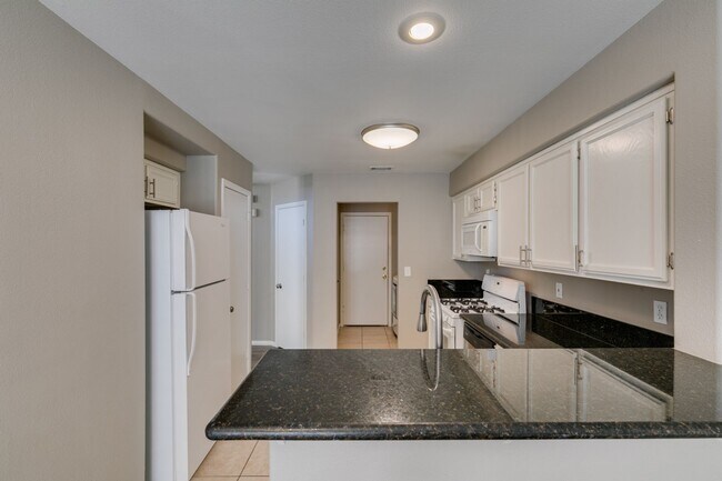 Building Photo - GORGEOUS HOME WITH TONS OF UPGRADES*GATED COMMUNITY WITH A COMMUNITY POOL*