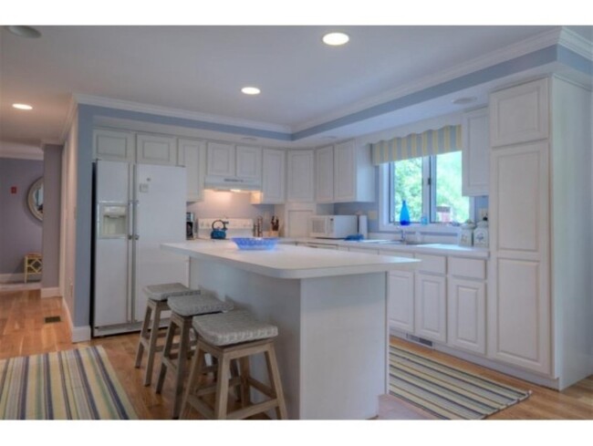 Open concept kitchen features lots of room for prepping meals - 8 Myrica Ave