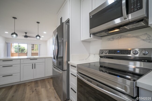 Building Photo - Rarely available ground floor townhome unit! 2 bdrm/2 bath/1 parking at Waiau Gardens Villa in Pe...