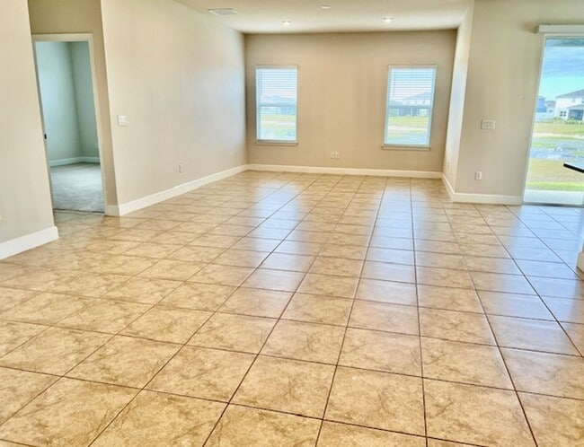 Building Photo - Open concept home offering four bedrooms, three baths, a two car garage and open lanai.