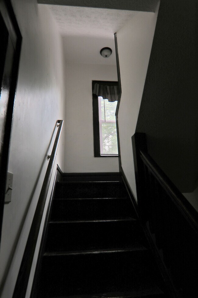 Stairway to first floor - 372 E Oakland Ave