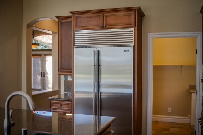 Entertain in this professional chefs kitchen with Sub-Zero and Viking adjacent to the great room. - 2850 Bronzino Ct