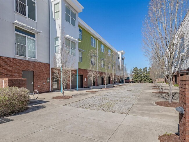 Building Photo - Downtown Durham 1bd/1ba Corner-Unit Condo with On-Site Personal 1-Car Garage!