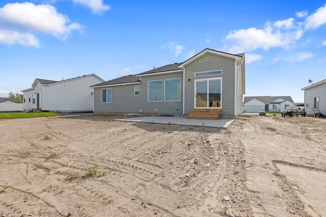 Building Photo - NEW HOME with large garage stalls and unfinished basement for additional storage