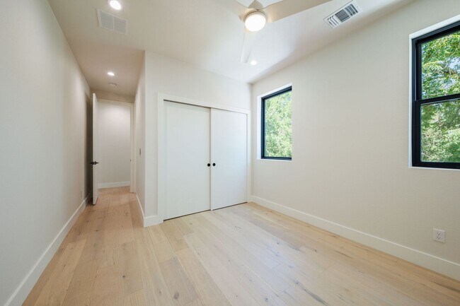 Building Photo - Luxury Redefined: Experience Vibrant Living in this 3-Bedroom Haven in East Austin