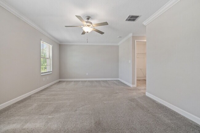 Building Photo - "Spacious 4-Bed Oasis with Granite Charm in Lutz!"In a gated community with 2 Cars garage