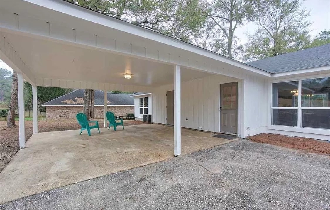Covered carport with large locking storage area - 113 Penny Ln