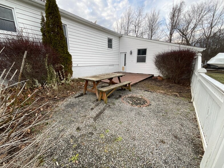 Back patio w/ fire pit - 3661 E Lake Rd