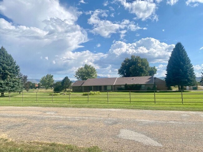 Building Photo - Beautiful home single level entry with out buildings and amazing landscaping - shorter term lease...