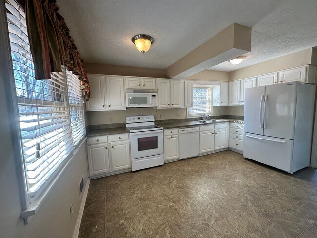 Building Photo - 3BR/3BA Home for Rent in J-town with Two Gar Garage and Large Deck!