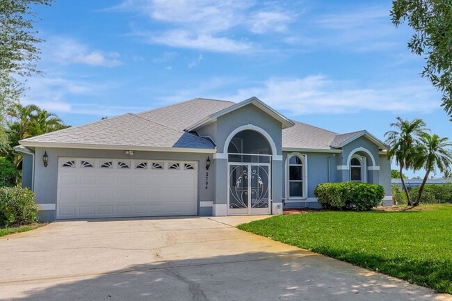 Building Photo - A BOATER'S PARADISE WITH THIS STUNNING 3 BEDROOM, 2 BATH WATERFRONT POOL HOME W/DOCK & BOAT LIFT ...