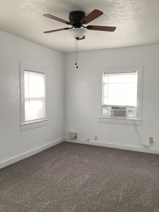 Building Photo - Freshly painted rooms in cute 2 bedroom home on quiet street!  Pets welcome!