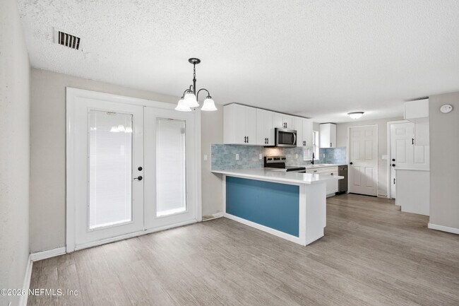 Building Photo - 7386 Dostie Dr E