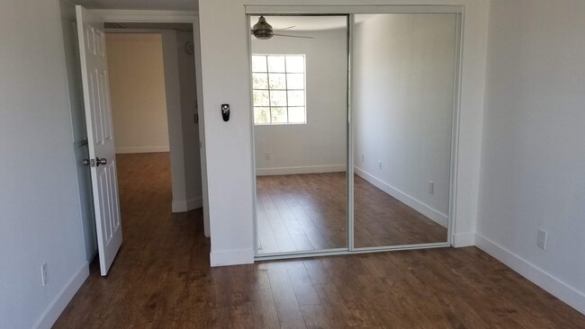 Secondary bedroom with linen closet and mirrored closet. - 14126 Tiara St