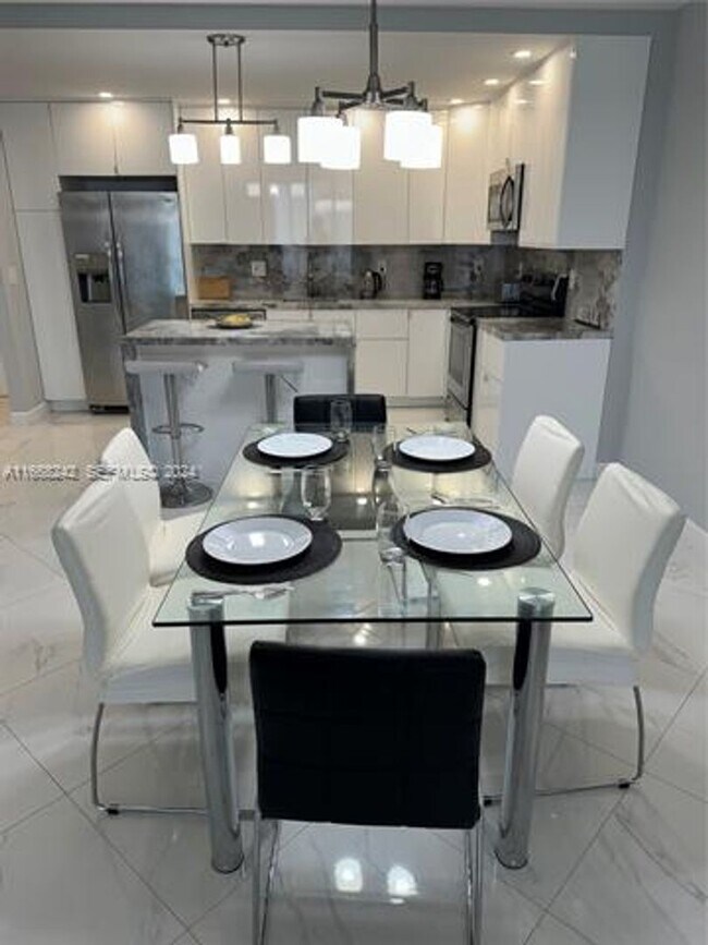 Building Photo - 19370 Collins Ave