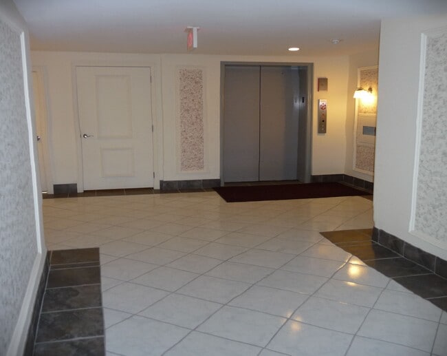 Back entry w elevator - 5200 Carriageway Dr