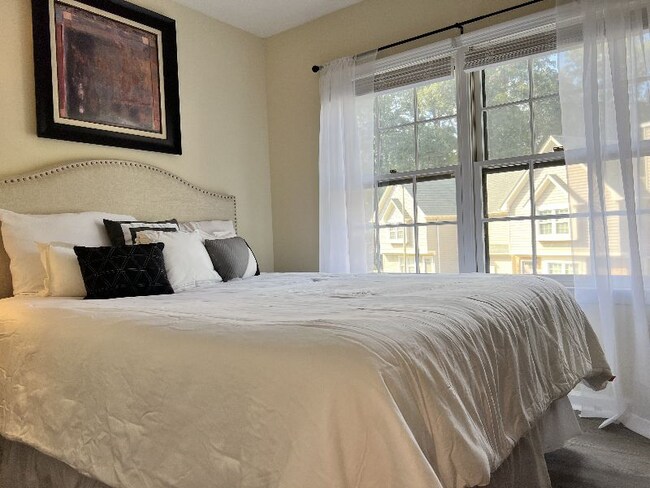 2nd Bedroom: Nightstand, Credenza, TV, Closet - 704 Rapidan River Ct