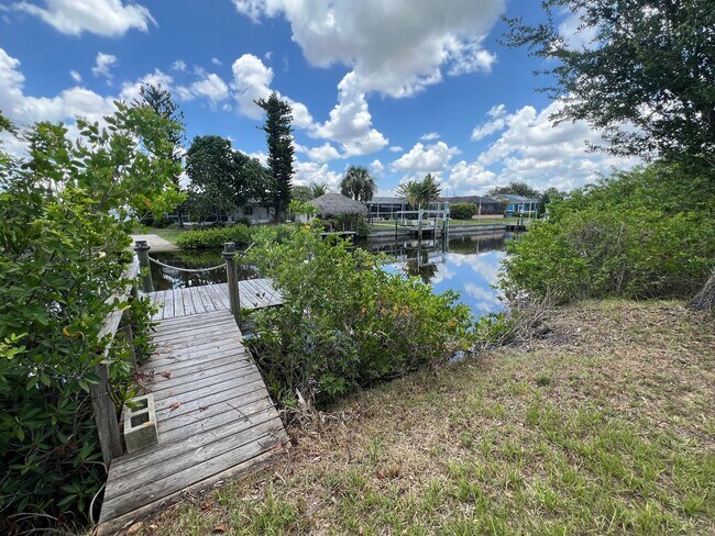 Building Photo - ANNUAL, UNFURNISHED * POOL * CANAL ** AVAIL 8/1/26 * 3 BEDS/2 BATHS * $2,095/month