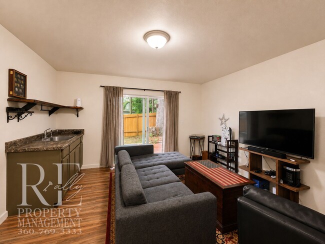 Building Photo - Spacious 3-Story Home with Flexible Living Space, Heat Pump & Private Deck Retreat