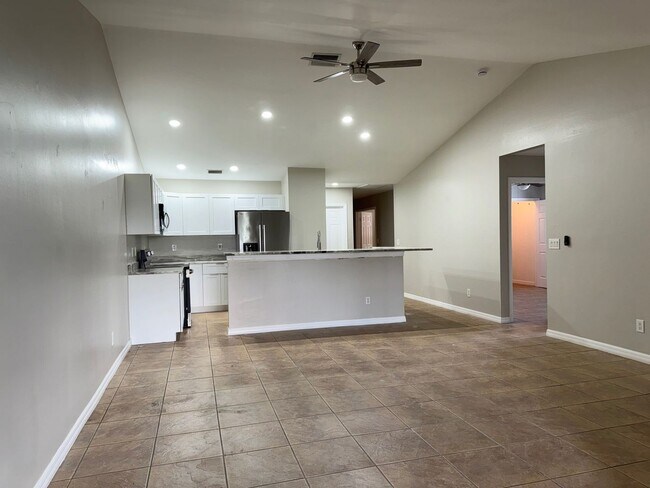 Building Photo - Experience this Cape Coral 3 bedroom 2 bath corner duplex with 1 car garage and screened in lanai.