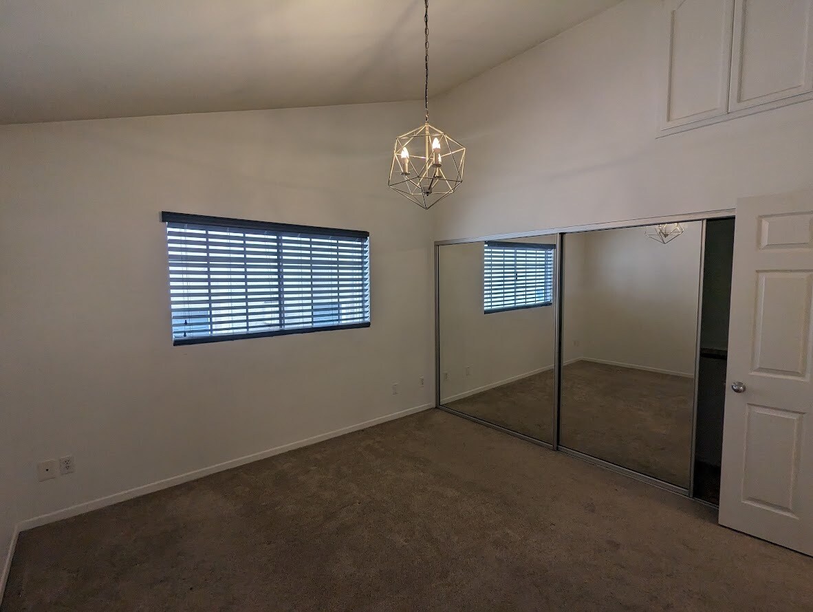 1 of 2 upstairs bedrooms with high ceilings and extra storage space - 2474 S Centinela Ave