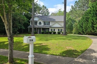 Building Photo - Commanding Curb Appeal, Conveniently Place