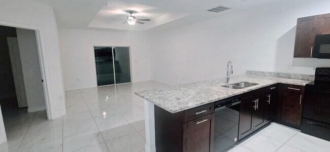 Building Photo - MUST SEE -2/2/1+OPEN DEN-DUPLEX IN GREENBR...