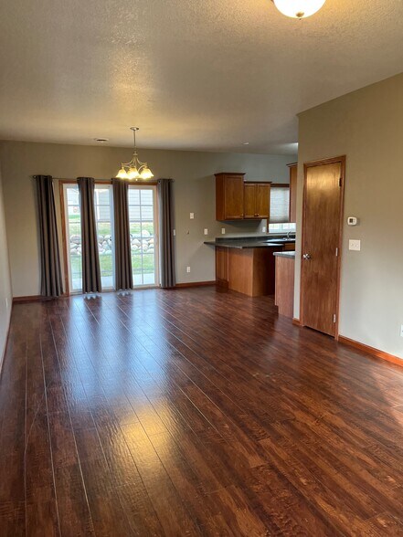 Spacious Living Room with abundant light, beautiful flooring, and open design. - 1501 Grove Pl