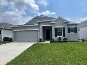 Building Photo - Like-New Lakefront Home in Sawmill Creek