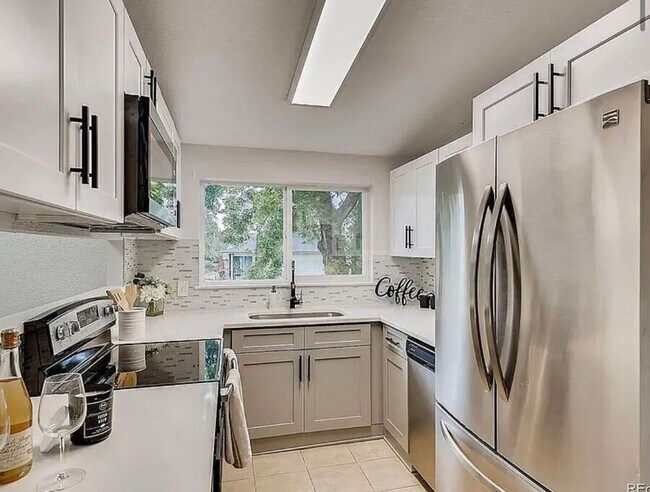 Building Photo - 7110 E 63rd Ave