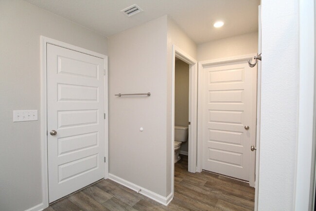 Building Photo - Coming Available Soon – 4BR/2BA Brick Home with Open Floor Plan, Solar Panels & 2-Car Garage in L...