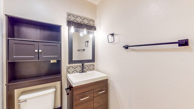 Building Photo - 2 story 2 bedroom 1 bath condo with covered parking, private storage and community pool!