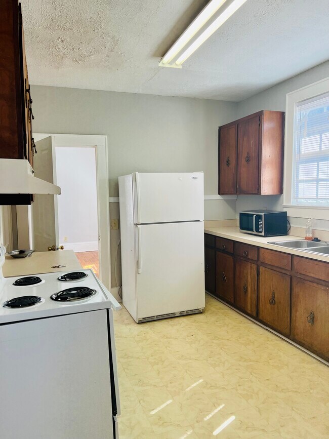 Kitchen (open door to bedroom 1) - 2602 Plum St