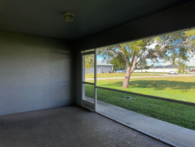 Building Photo - Experience this Cape Coral 3 bedroom 2 bath corner duplex with 1 car garage and screened in lanai.