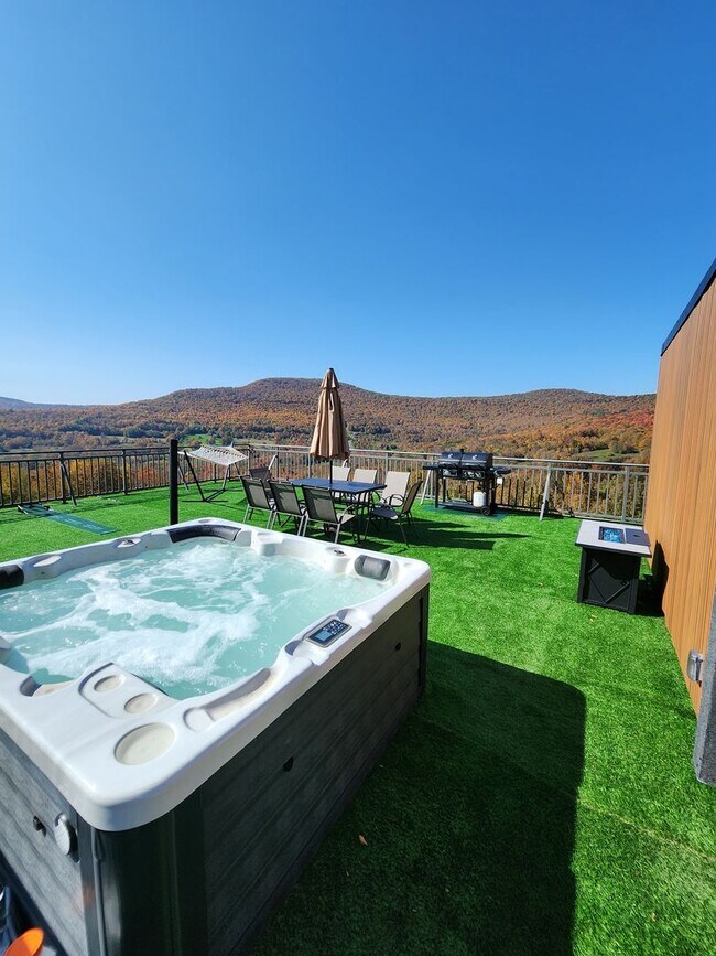 Building Photo - Modern Mountain Retreat with Rooftop Hot T...