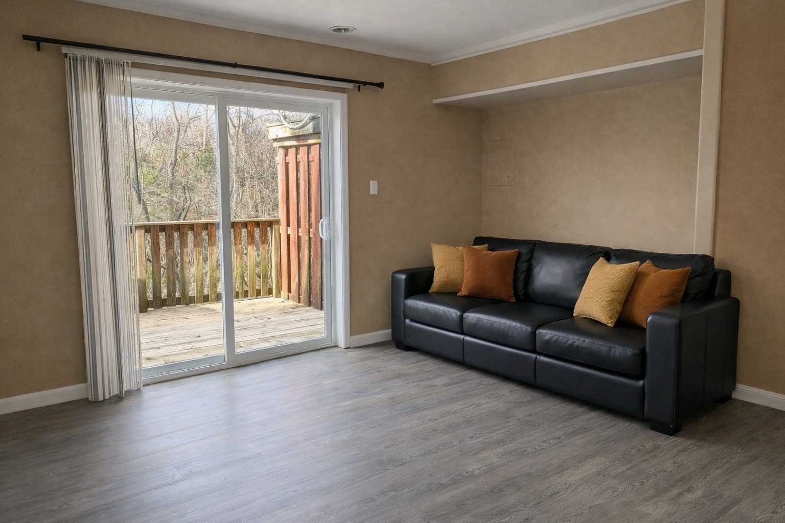Living room with glass patio doors - 105 Windy Cir