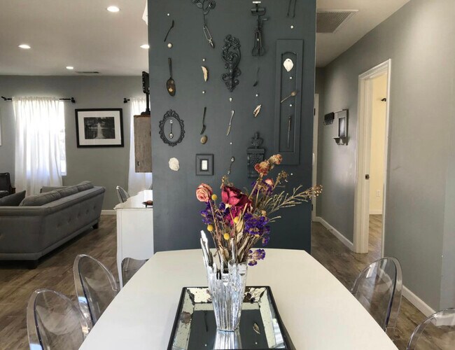 Dining area looking to living room on left and bedrooms on right - 6735 Saint Clair Ave