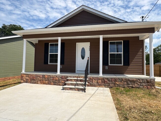 Building Photo - Charming New Home with a Rocking Chair Front Porch!