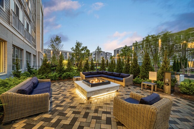 Fireside lounges in the social courtyard offer the ideal space to unwind - Hanover Hyannis