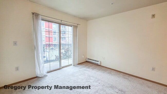 Building Photo - Sunny Capitol Hill 2 BR 1.5 BA Condo with Garage Parking Included & Skyline Views!
