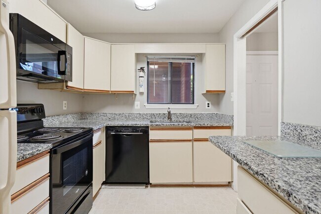 Building Photo - Contemporary design meets exceptional space in this inviting ground level residence, offering eff...