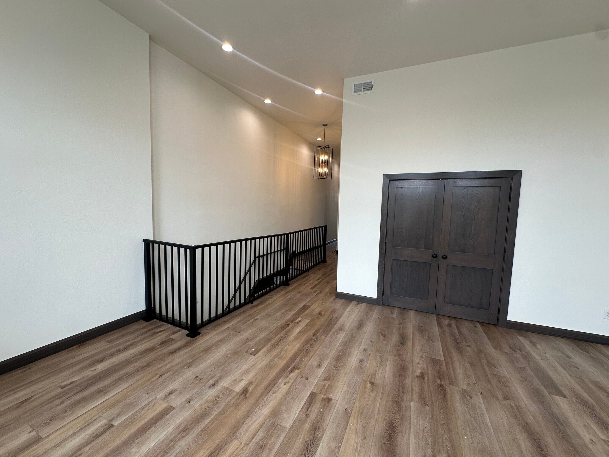 Living room looking back towards bedroom and entry. - 210 S Main St