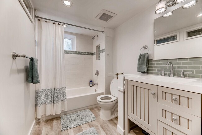 The bathroom vanity has outlets inside the cabinet for blow dyers, shavers, etc. The hand glazed til - 11639 1st Ave NW