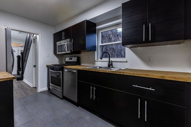 Building Photo - AVAILABLE APRIL - Open Concept 3 Bedroom Home w/ Character Throughout!